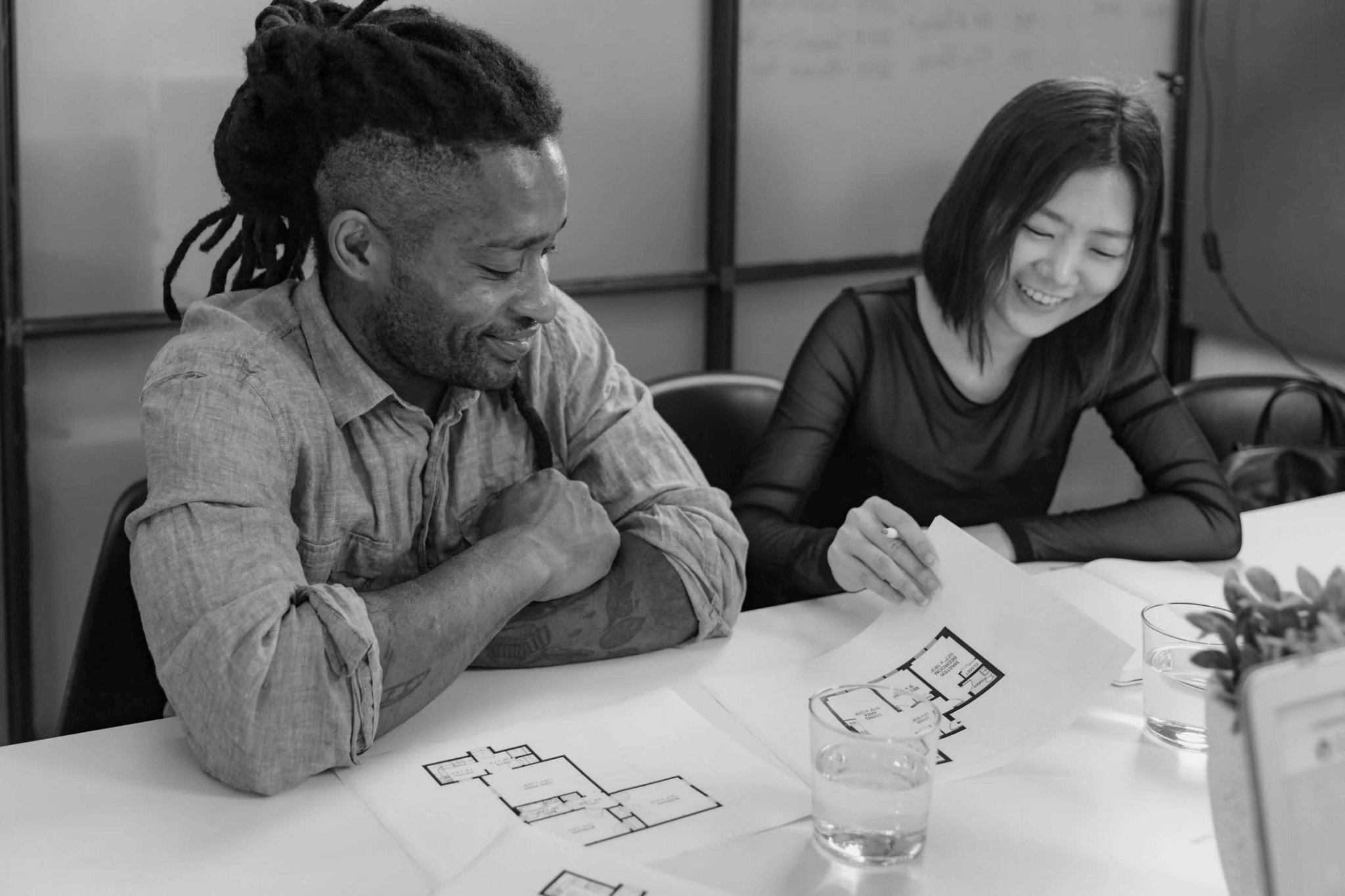 Architects looking at plans in office