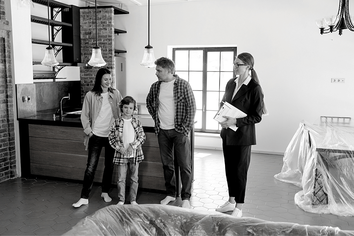 An agent showing the house to her clients