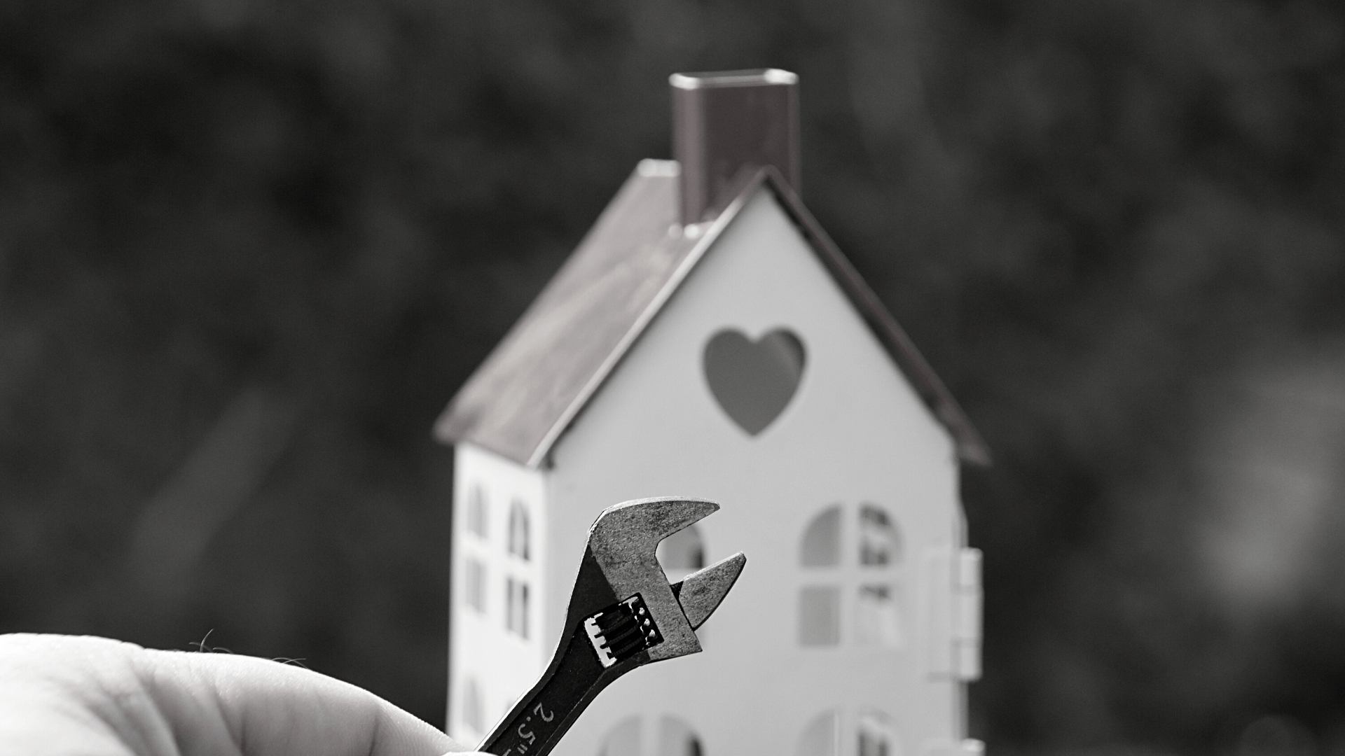 House with work tools as repair and maintenance concept