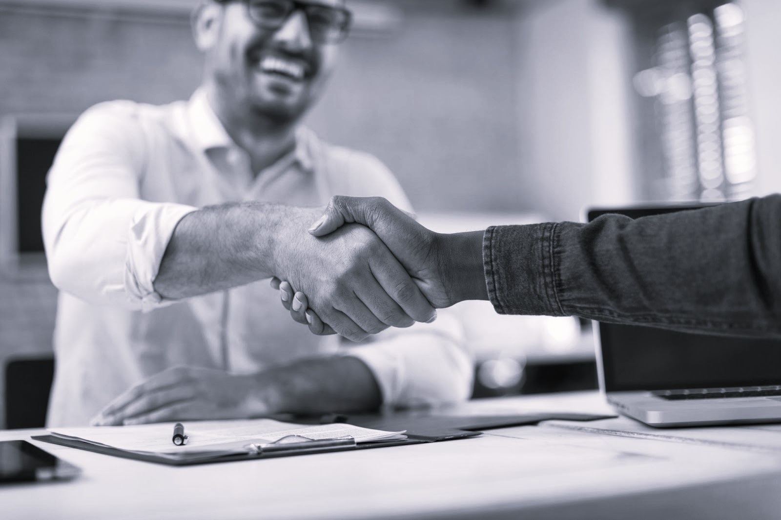 Close up of handshake in the office