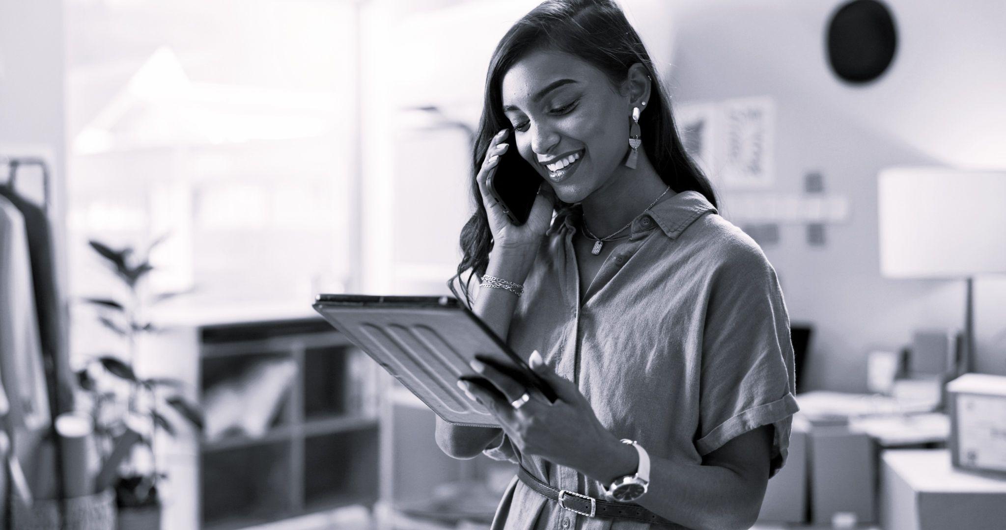 Happy woman or employee talking on mobile smartphone for order