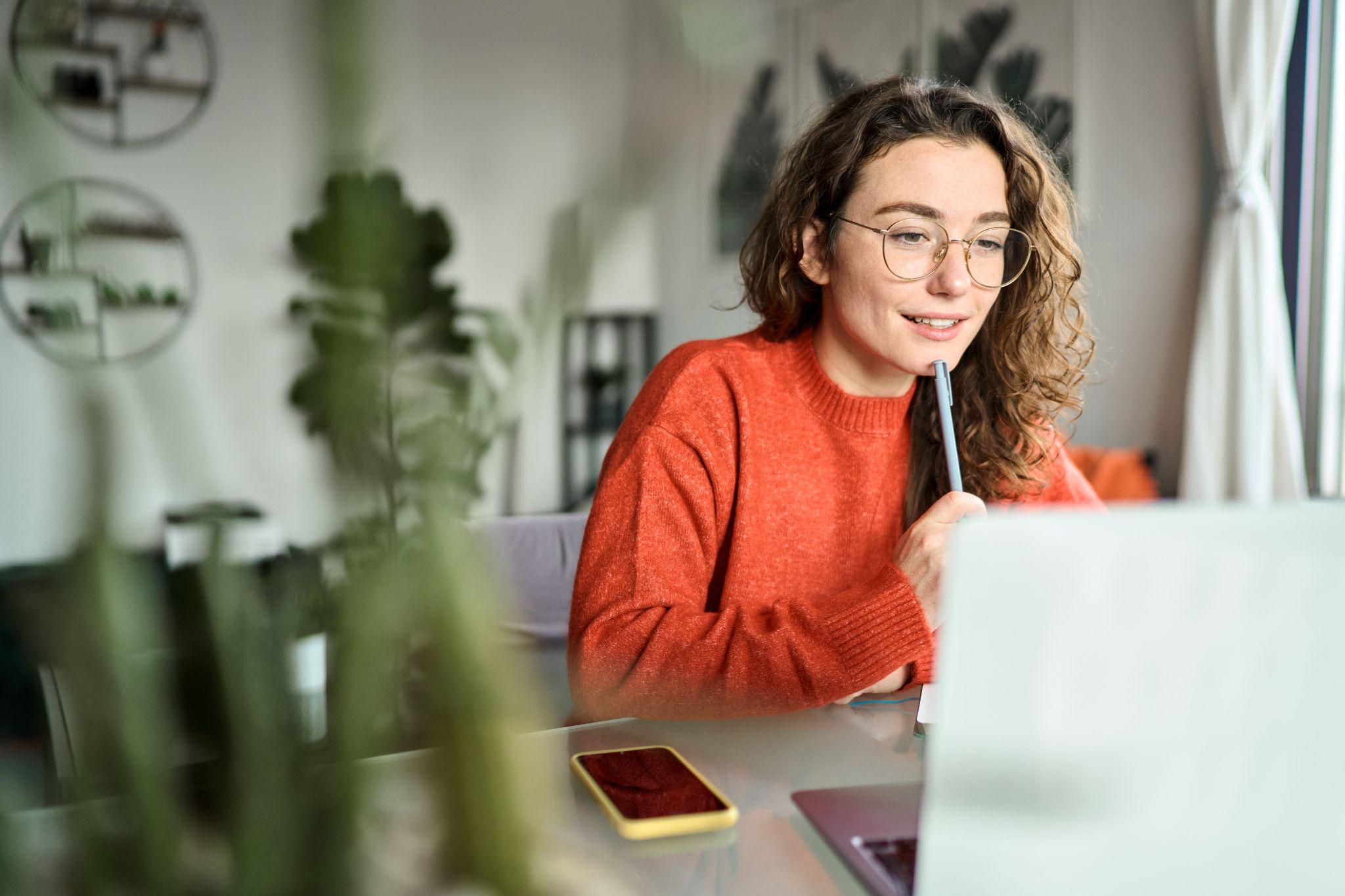 Girl looking at properties on her laptop
