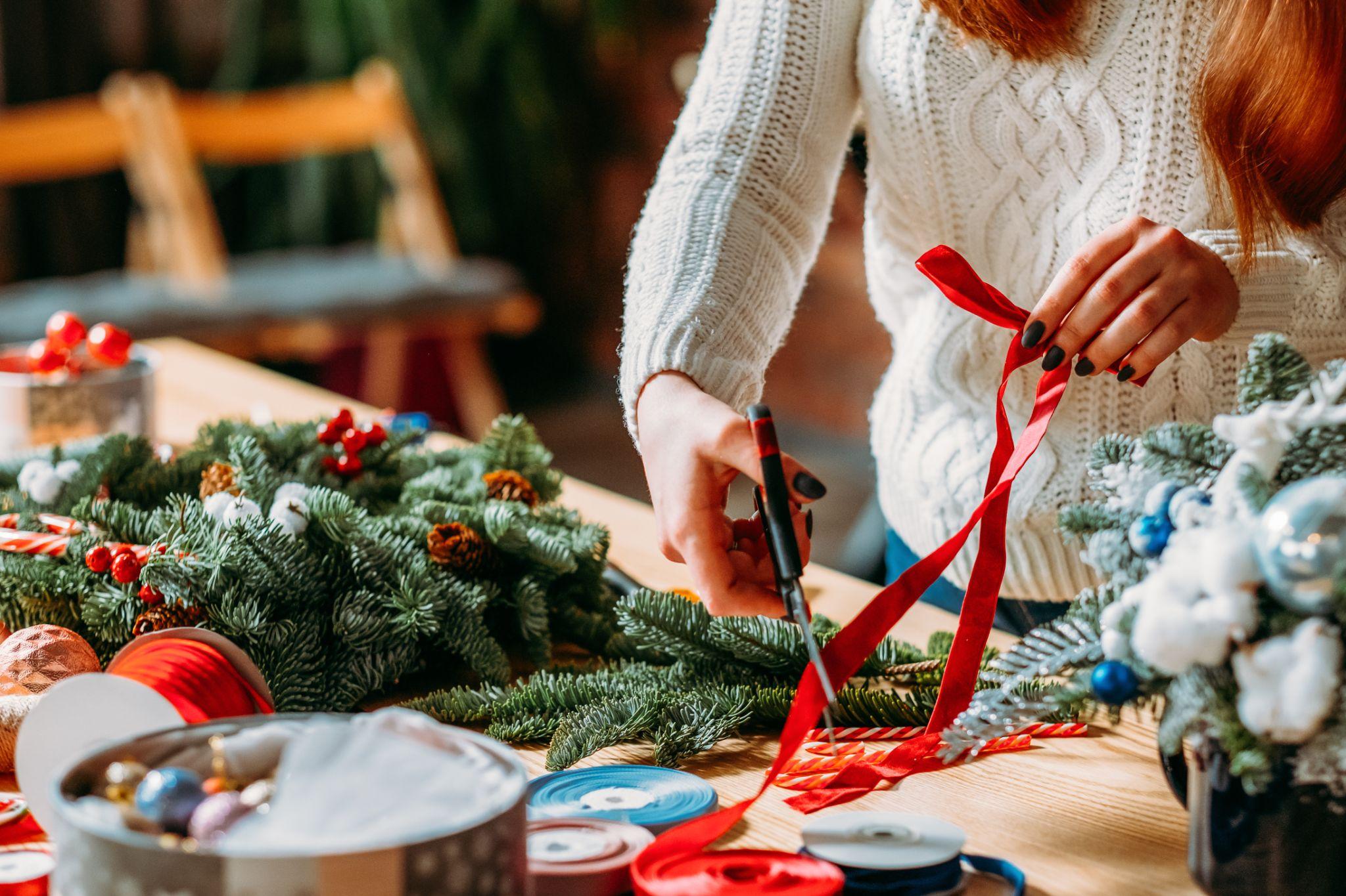 A woman doing holiday crafts